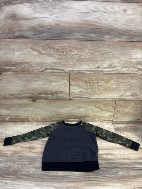 Front view of Old Navy Camo Sleeve Thermal Shirt in grey, showcasing camouflage sleeves and black ribbed cuffs with a wood background