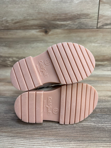 Bottom view of pink Cat & Jack kids shoes size 6 with non-marking soles on wood floor