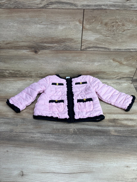Front view of Little Me pink lightweight puffer jacket showcasing black trim and four pockets on wood flooring