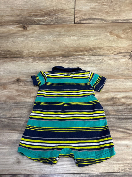 Back view of Simple Joys striped polo shortie romper showing navy, teal, white and yellow horizontal stripes with polo collar on wood background