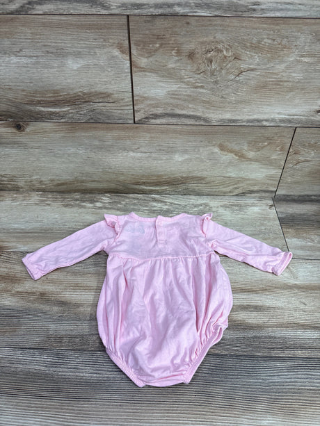 Front view of Barbie pink long sleeve bubble romper, size 3 months, showcasing ruffled shoulders with wood floor background