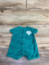 Front view of green Carter's short-sleeve button-front shortie romper showcasing navy rhino print and white lion face patch, laid flat on wood floor