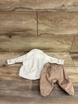 Just One You 2pc white corduroy button-up shirt and tan pants set for newborns on wood background