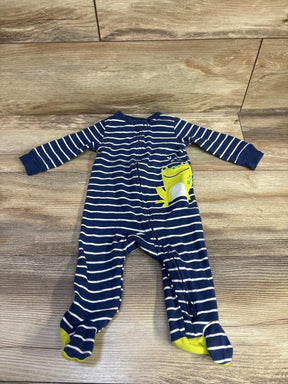 Front view of Carter's navy and white striped footed sleeper showcasing a green frog appliqué on the chest, size 6 months, on a wood floor
