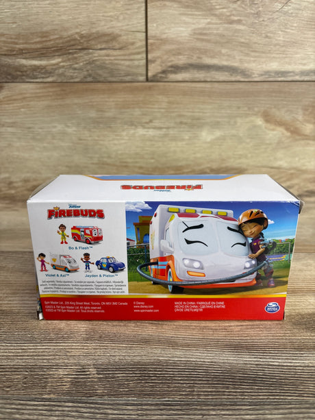 Disney Firebuds Bo & Flash toy set box on wood background, featuring animated firetruck and characters.