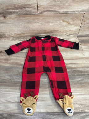 Red plaid baby sleeper with reindeer footies on wood floor, long sleeves, cute holiday outfit