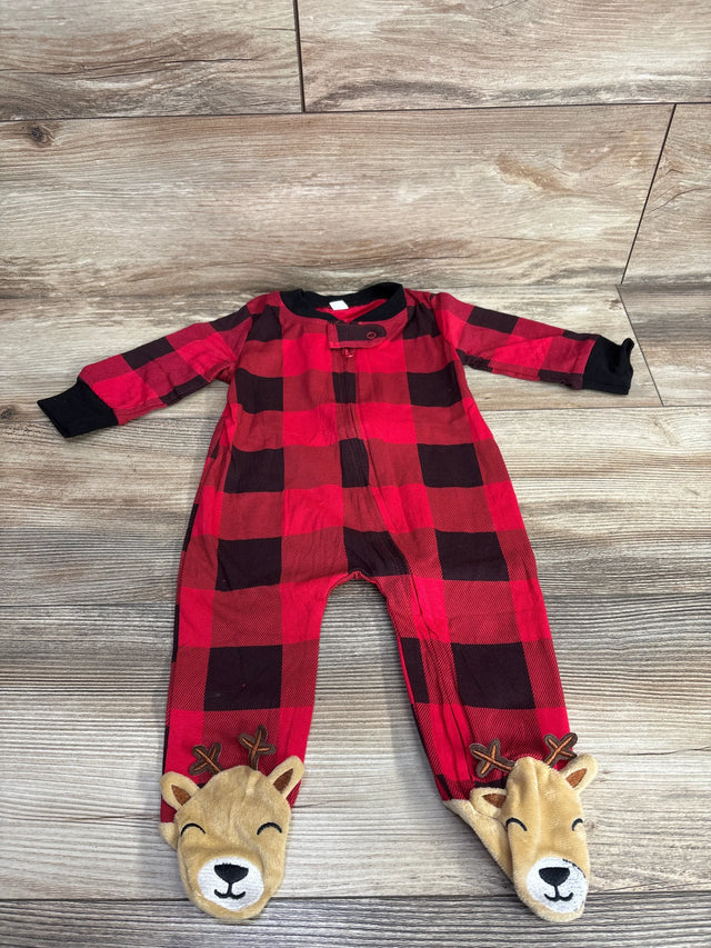 Red plaid baby sleeper with reindeer footies on wood floor, long sleeves, cute holiday outfit