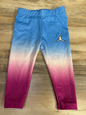 Kids' Jordan leggings with blue to pink ombre design and Jumpman logo on wooden floor