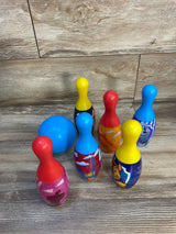 Colorful kids plastic bowling set with cartoon characters on wood floor