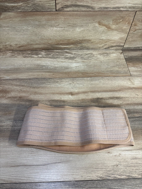 Flat lay of AJ Maternity belly band showing elastic ribbed front and soft padded lining on wood floor