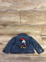 Back view of Baby Gap x Disney baby denim jacket showcasing large embroidered Minnie Mouse patch, button cuffs on wood floor