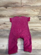 Back view of Disney Baby Minnie Mouse magenta 12m jumpsuit with short sleeves, cuffed legs, washed fabric on wood floor