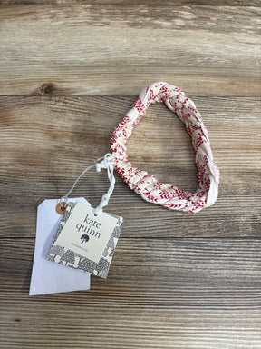 Kate Quinn kids braided white and red patterned headband with tag on wooden surface