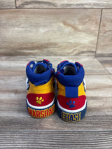 Rear view of toddler high-top Paw Patrol sneakers size 6C with Marshall and Chase on heels and paw-print detail on wood floor