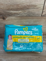 Front view of Pampers Preemie Swaddlers pack with up to 100 percent leakproof skin protection claim, size P1 27ct on wood