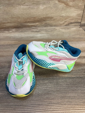 Front three-quarter view of Puma RS-X3 WR toddler sneakers, white with multicolor accents, mesh upper on wooden floor