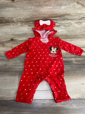 Red polka dot baby romper with Minnie Mouse design and bow hood on wood background