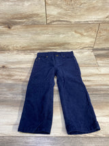 Front view of Janie and Jack navy toddler corduroy pants, size 2T, showing front pockets, button closure on wood floor