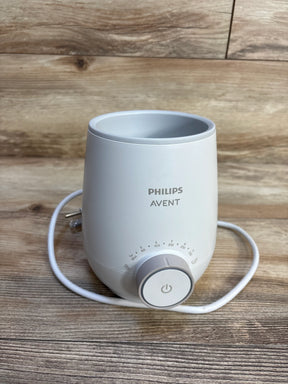 Philips Avent bottle warmer on wooden surface, ideal for baby gear and maternity needs
