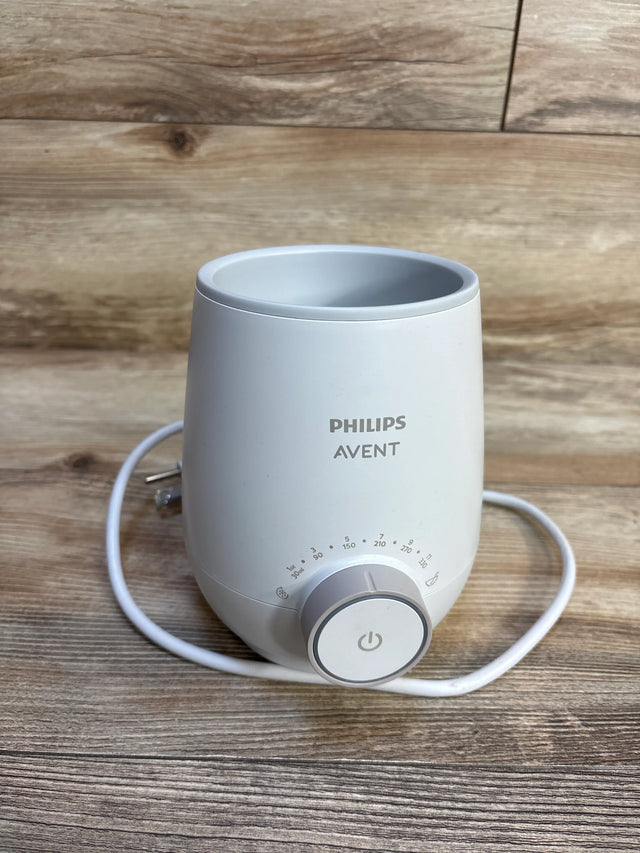 Philips Avent bottle warmer on wooden surface, ideal for baby gear and maternity needs