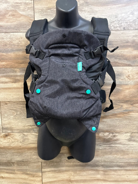 Front view of Infantino Flip 4-in-1 Convertible Baby Carrier in grey on a mannequin with straps and buckles