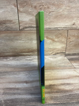 Magic Muri kids book with green and blue spine, standing on wood floor