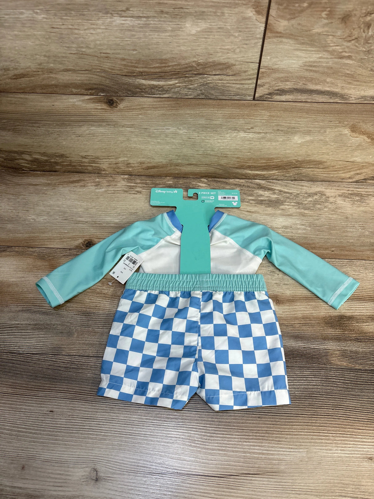 Disney baby 2-piece swim set with blue checkered shorts and long-sleeve rash guard