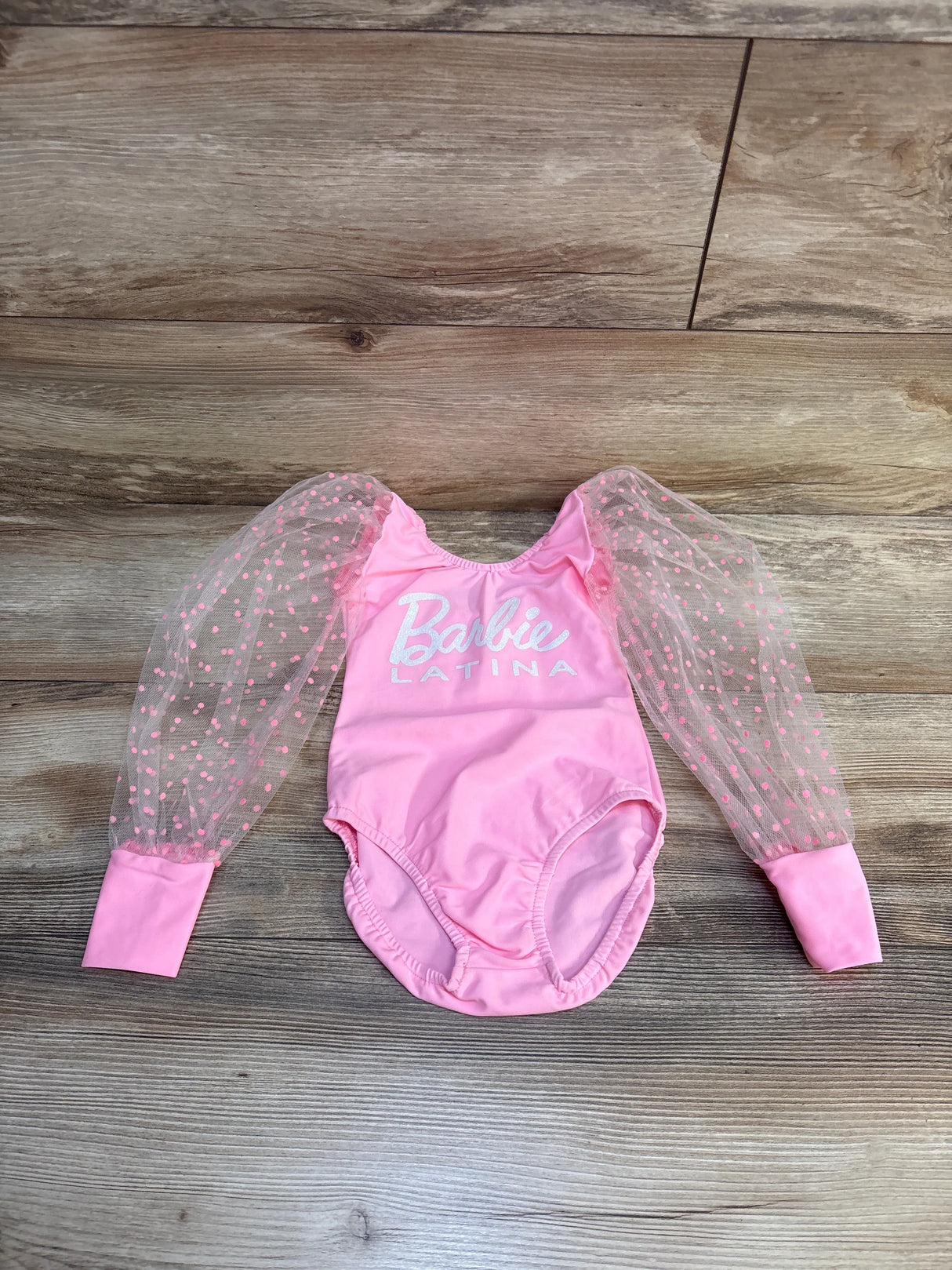 Pink Barbie Latina baby onesie with tulle polka dot sleeves, perfect for infant girls' outfits
