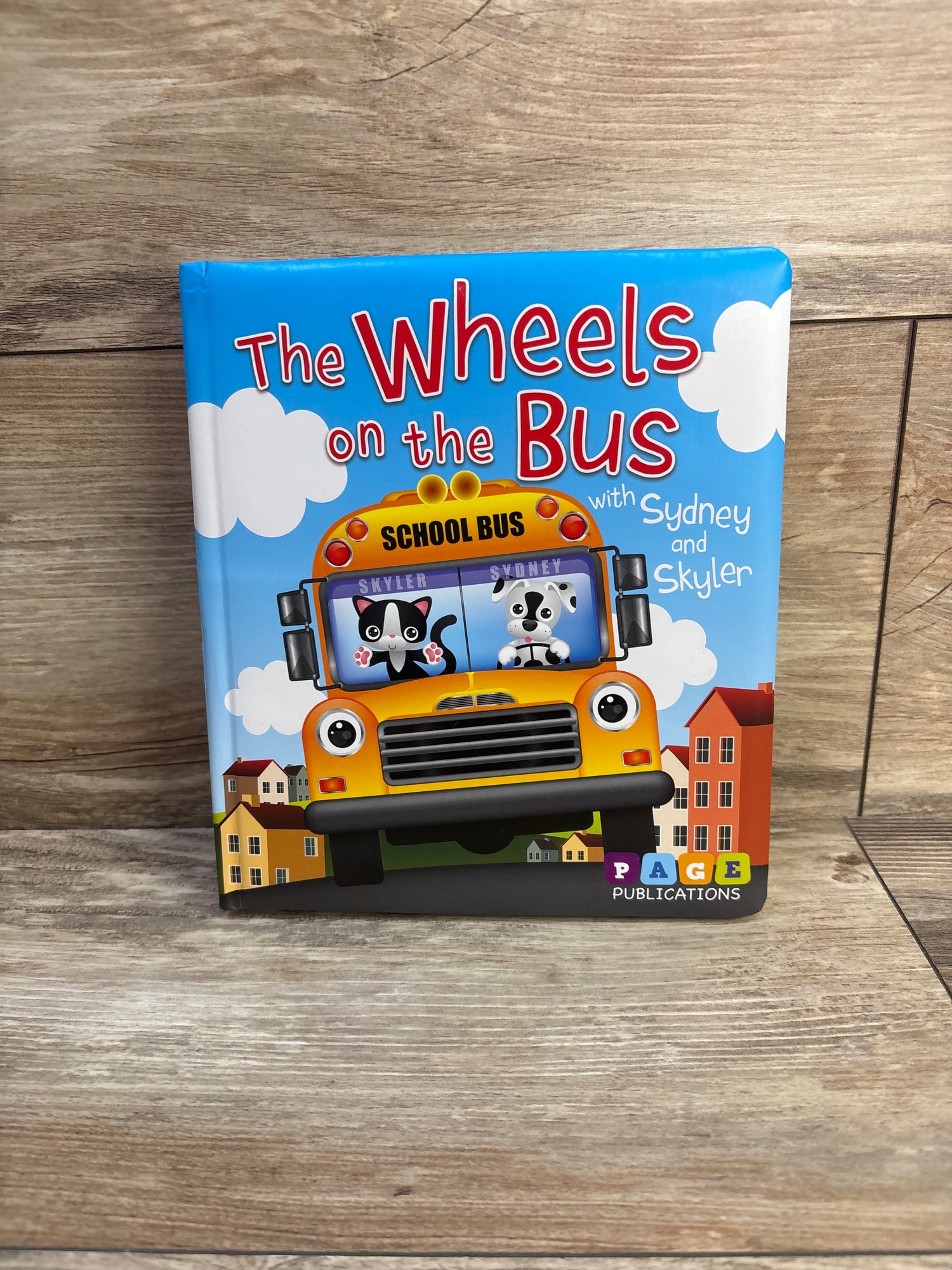 The Wheels on the Bus with Sydney and Skyler Padded Board Book