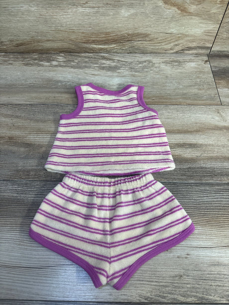 Flat lay of newborn ivory terry cloth tank top and shorts set with purple stripes and elastic waistband on wood background