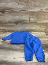 Flat lay Baby Gap Sesame Street blue sweatshirt and joggers, back of top visible, Cookie Monster on right pant leg