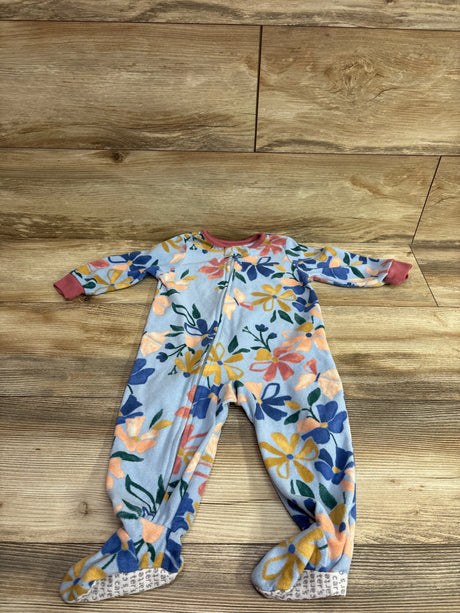 Front view of Carter’s blue floral blanket sleeper, size 12 months, showcasing footed legs and front zipper on a wood floor