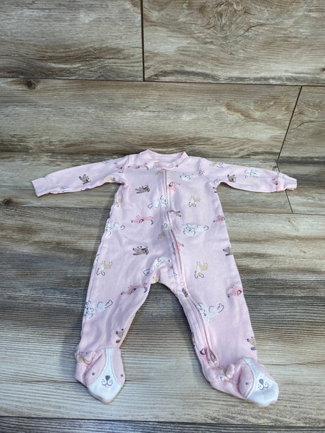 Top-down view of pink Carter's footed baby sleeper size 9M showcasing dog-face feet and all-over animal print on wood floor