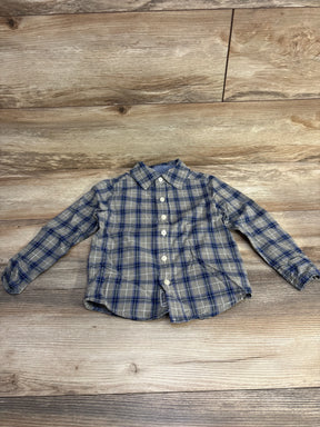 Flat lay of OshKosh toddler plaid button-up shirt size 4T showing front buttons and collar on wood floor background