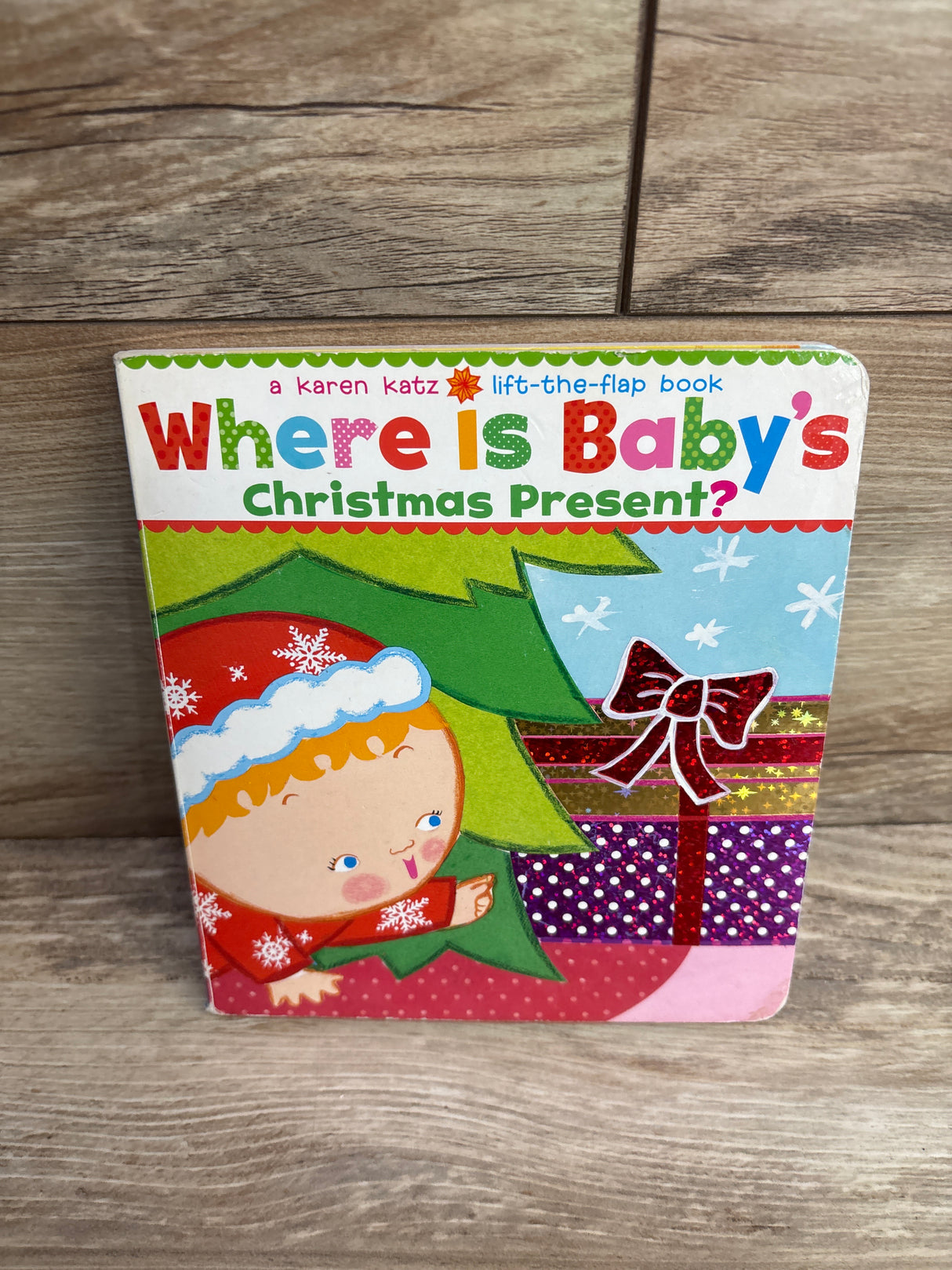 Where Is Baby's Christmas Present?: A Lift-the-Flap Board Book