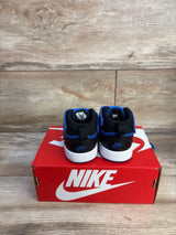 Rear view of toddler Nike Court Borough sneakers in black and game royal with Velcro on red Nike box