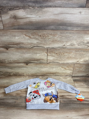 Gray toddler sweatshirt with cartoon puppies and Peek-a-boo text, displayed on wood floor