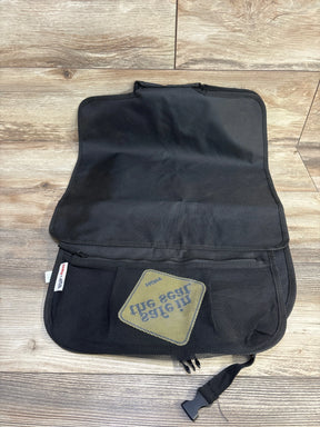 Top view of Nuby Safe in the Seat car seat protector with fold-out zippered mesh pockets and buckle strap on wood floor