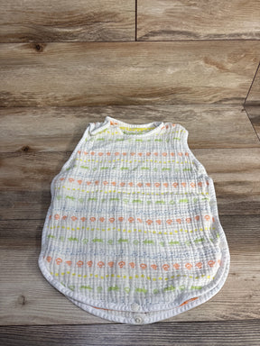 Soft baby sleep sack with animal print on wood floor, multicolor muslin wearable blanket
