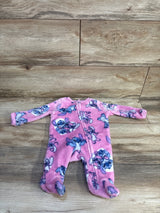 Front flat-lay of pink Disney Lilo & Stitch footed sleeper size 0-3 months showing plush fleece fabric on wood background