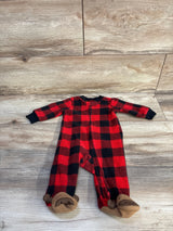 Flat-lay of Carter's red and black buffalo plaid footed blanket sleeper, 3 month, showing front zipper and bear-face footies on light wood floor