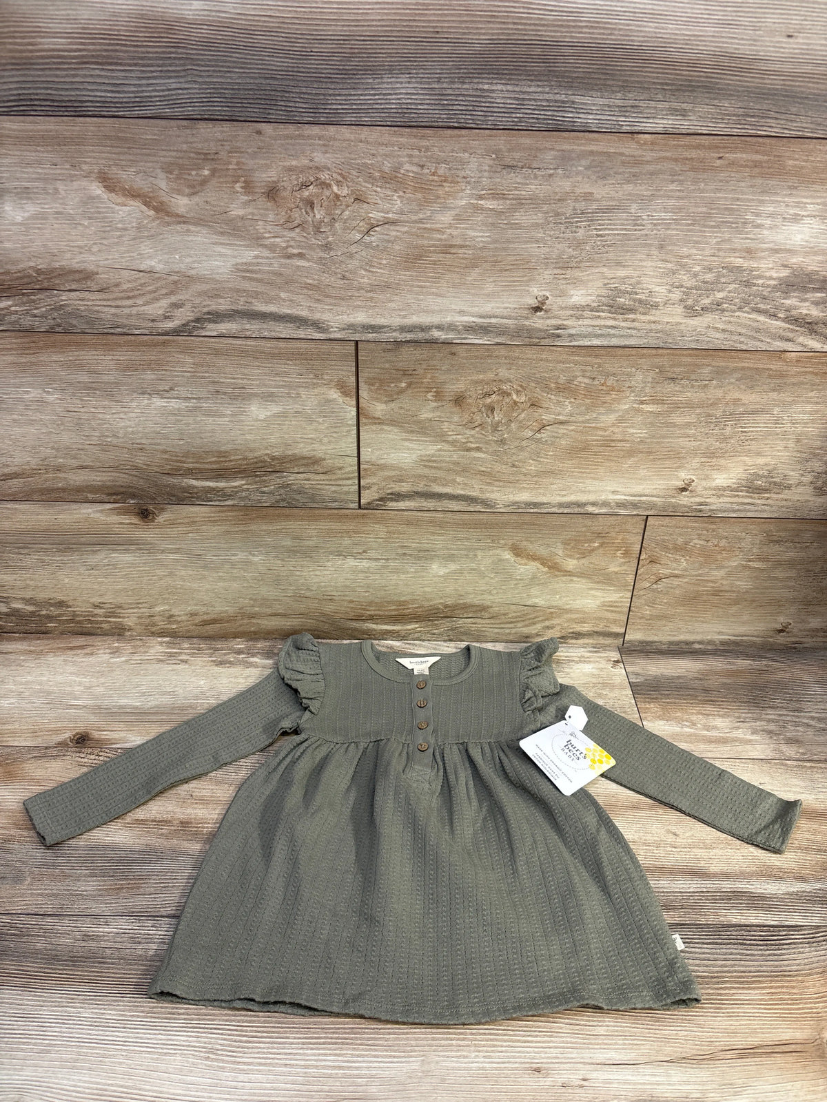 Green long sleeve tunic dress for toddlers by Me n Mommy To Be on a wood background