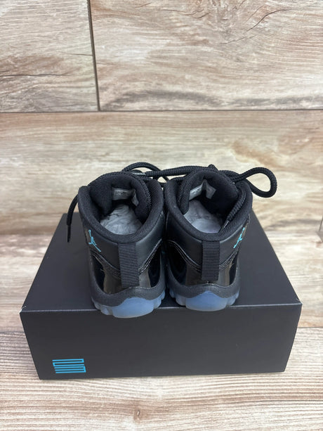 Rear view of Air Jordan 11 Retro TD Gamma Blue sneakers in size 8C with black uppers, blue accents and translucent soles
