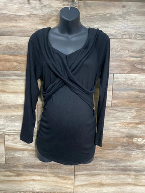 Front view of black Isabel maternity cross-front top size L, wrap bodice and ruched sides on mannequin with wood background