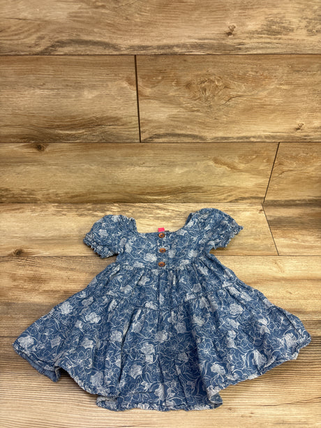 Front view of Vince Camuto blue chambray dress with tiered skirt floral print puff sleeves and button front on wood flooring