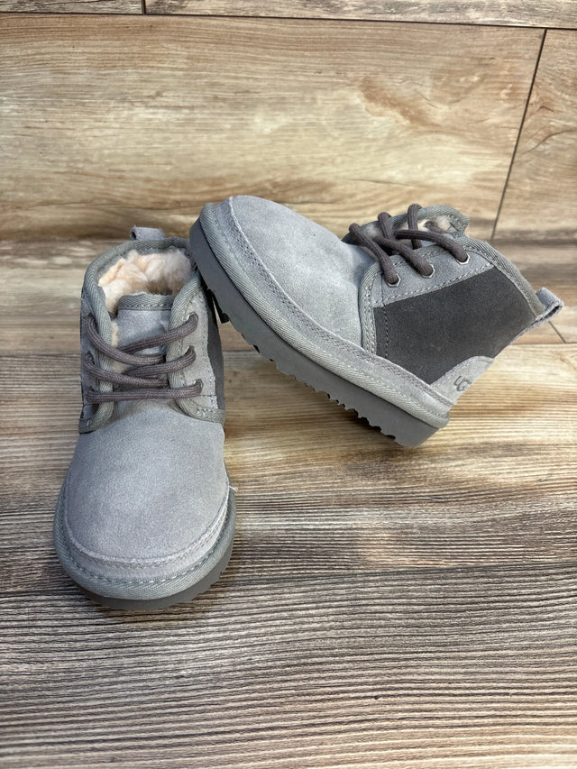 Gray suede toddler boots with faux fur lining on wood background