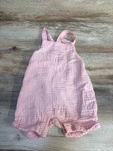 Soft pink muslin baby romper with ruffled legs, perfect for newborns and infants.