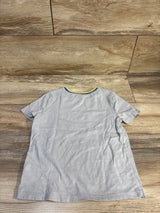 Back view of Old Navy grey heather toddler t-shirt size 5T showing green and yellow trim at the crew neckline on wood floor