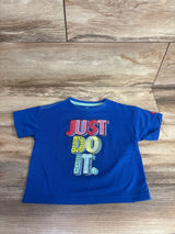 Blue toddler t-shirt with colorful textured letters spelling Just Do It on wooden floor