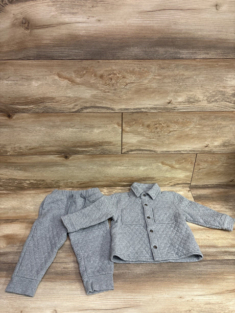 Grey Old Navy 2-piece quilted button-up jacket and pants set for toddlers on a wood background